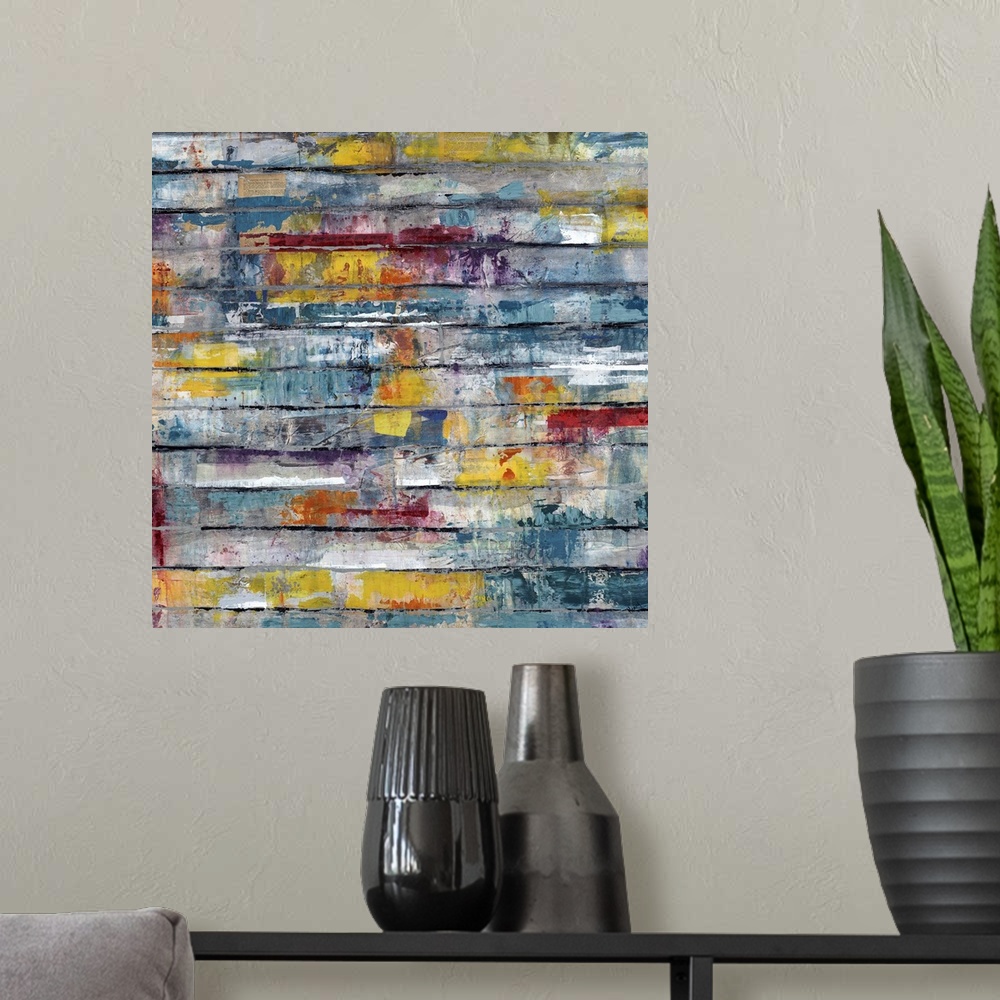 A modern room featuring Contemporary abstract painting of splashes of color on weathered planks.
