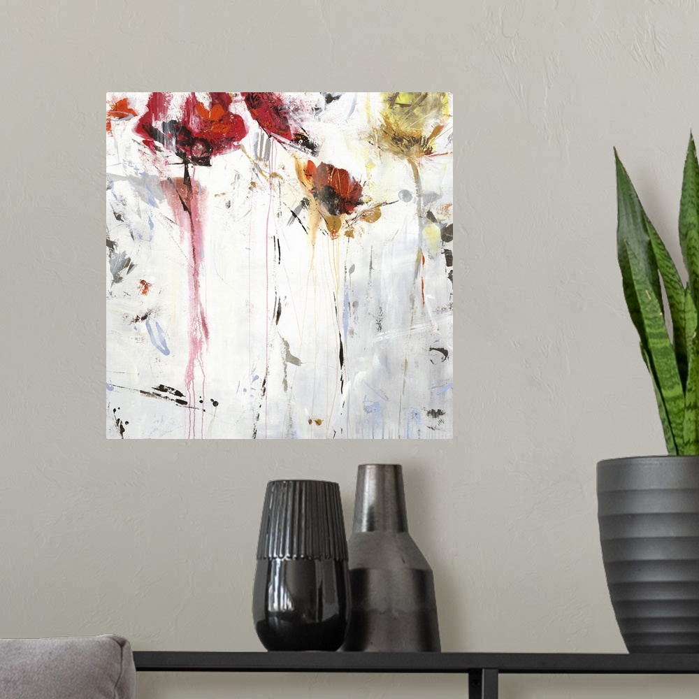 A modern room featuring Square abstract floral painting in shades of red, orange and white.