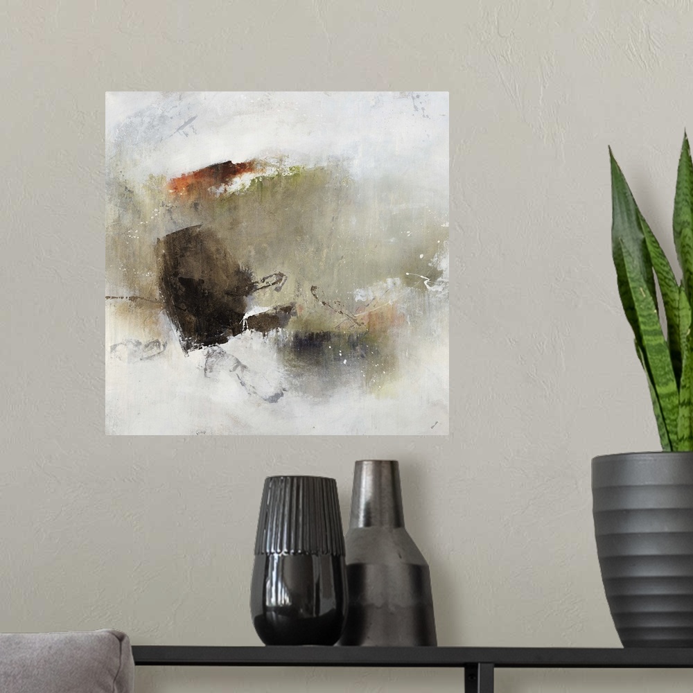 A modern room featuring Abstract painting of a cluster of shapes and earth tone colors with the appearance of watercolors...