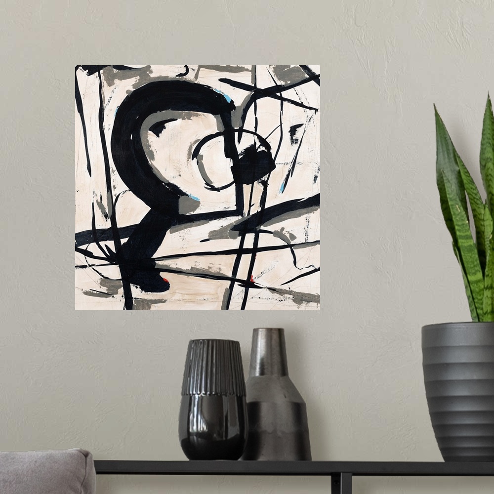 A modern room featuring Contemporary abstract painting using bold black lines against a neutral toned background.