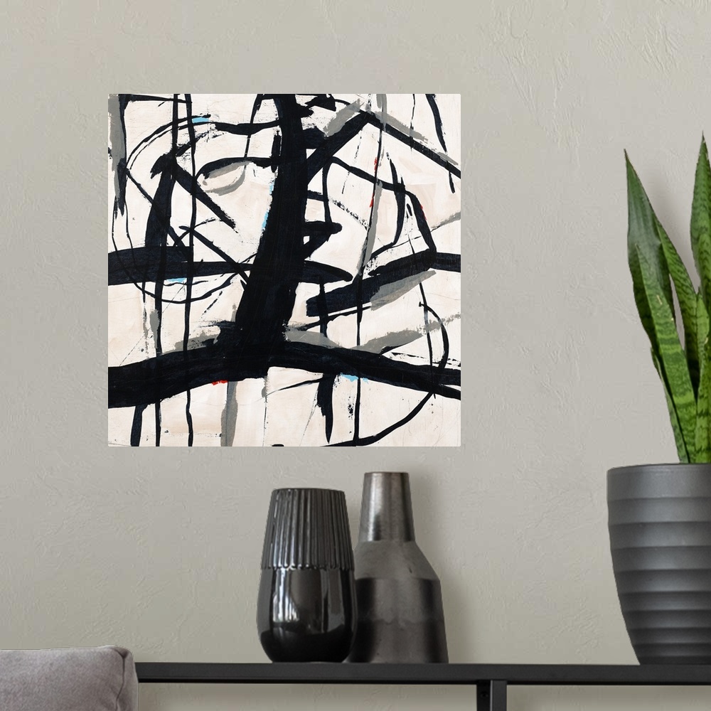 A modern room featuring Contemporary abstract painting using bold black lines against a neutral toned background.