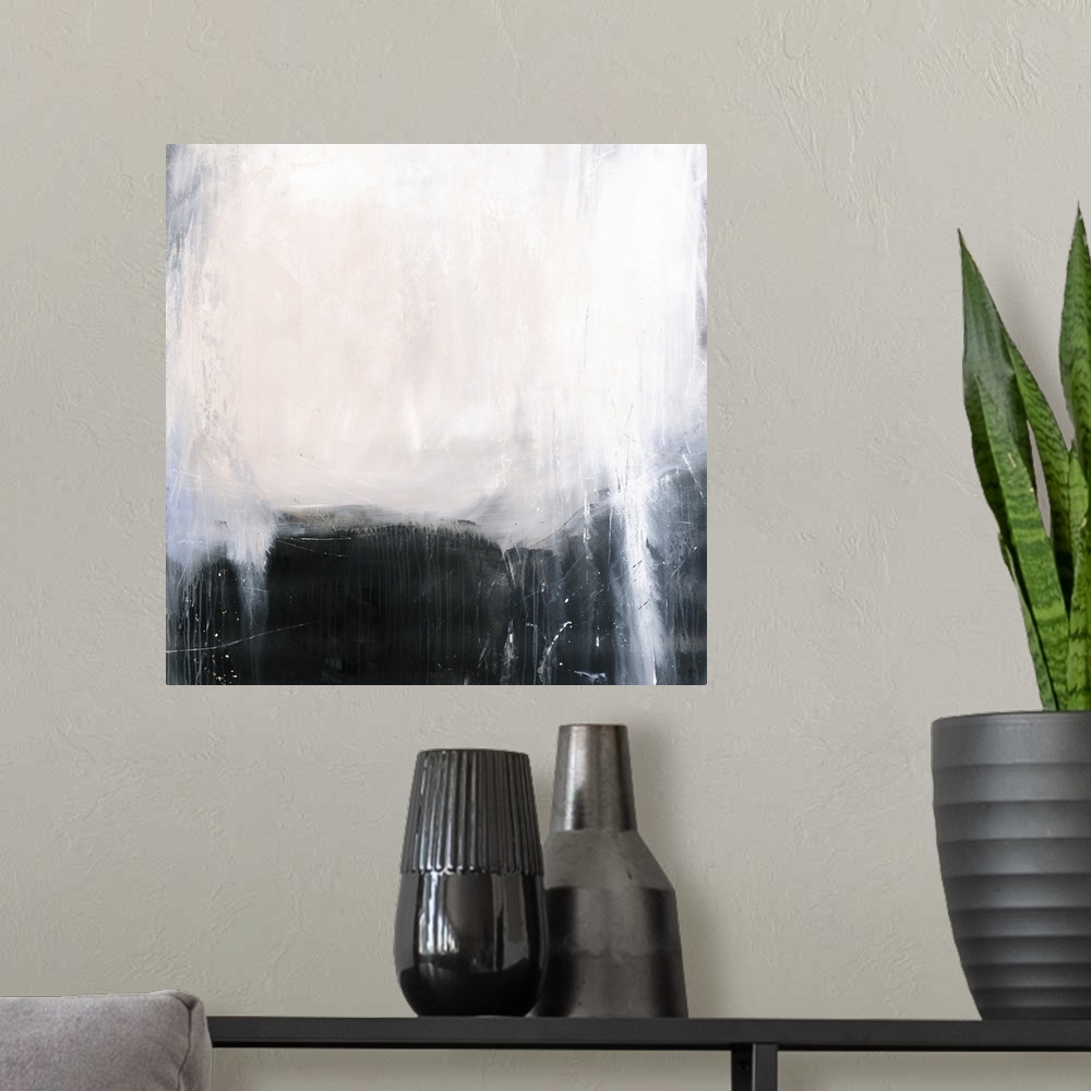 A modern room featuring Square abstract painting with a dark black and gray background and a big white spot at the top wi...