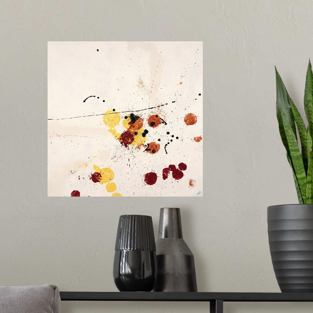 A modern room featuring Abstract painting using red and yellow paint splatters on a neutral toned background.