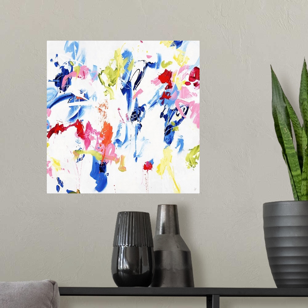 A modern room featuring A contemporary abstract painting of various vibrant colors dancing around a white space.