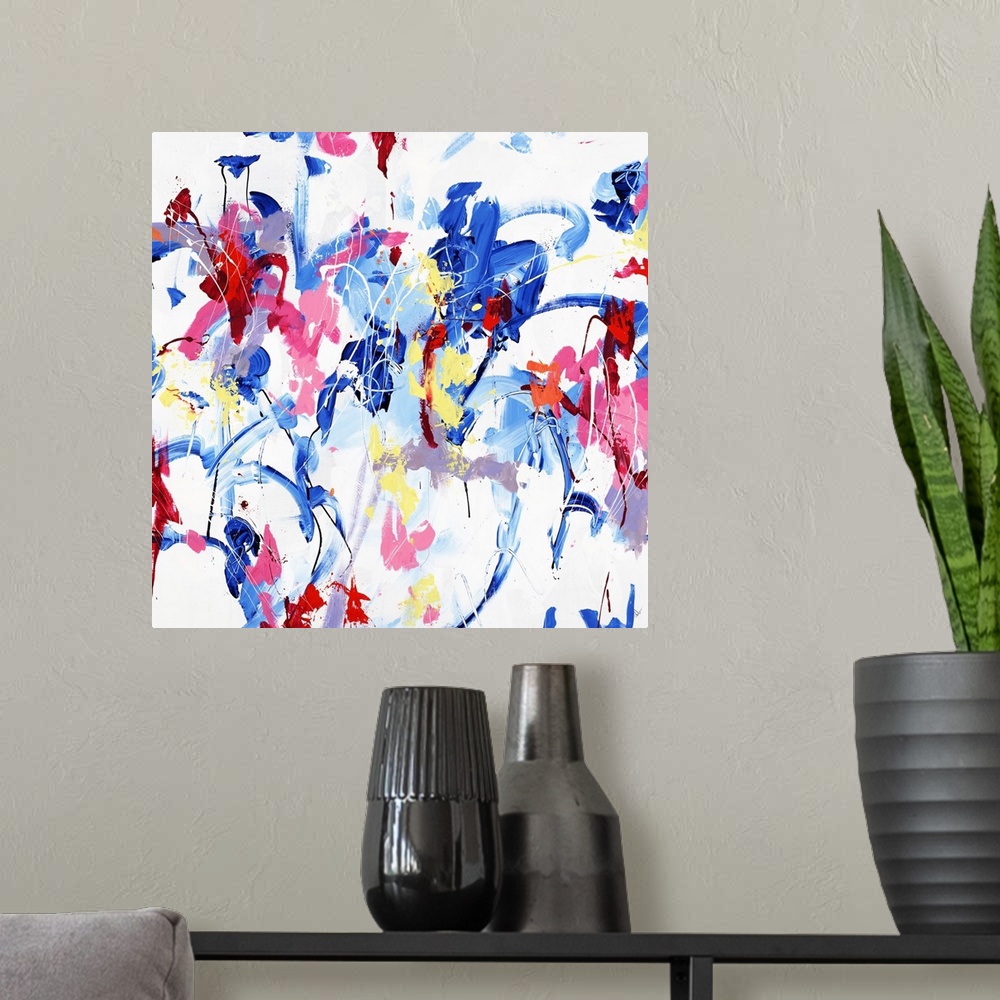 A modern room featuring A contemporary abstract painting of various vibrant colors dancing around a white space.