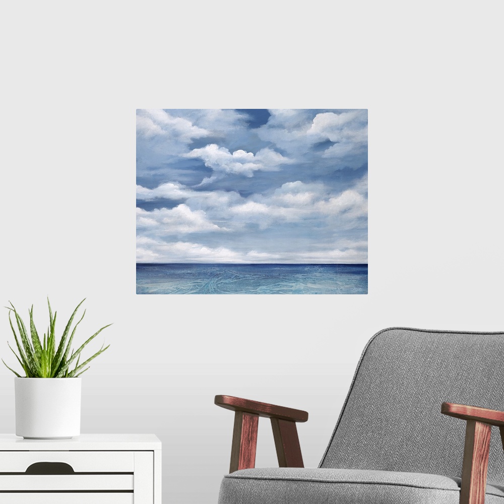 A modern room featuring Contemporary artwork of a serene ocean view with bright clouds above.