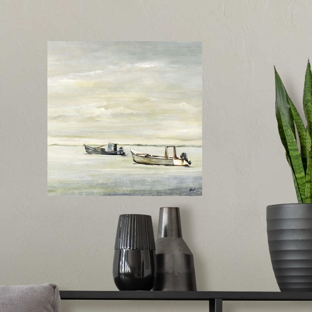A modern room featuring Painting of two small fishing boats sitting in calm water beneath a cloudy grey sky.