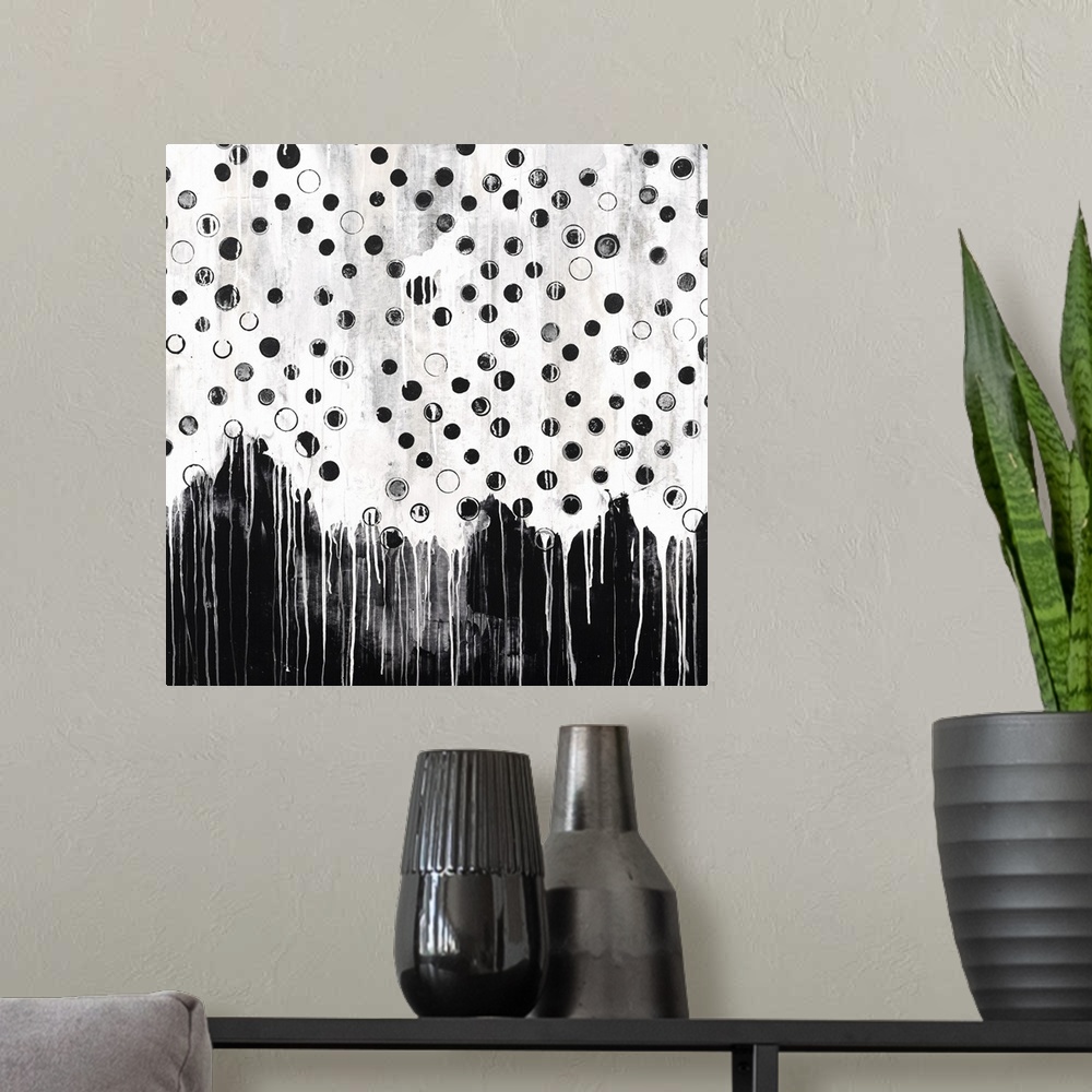 A modern room featuring Contemporary abstract painting in black and white, with a dripping paint effect.