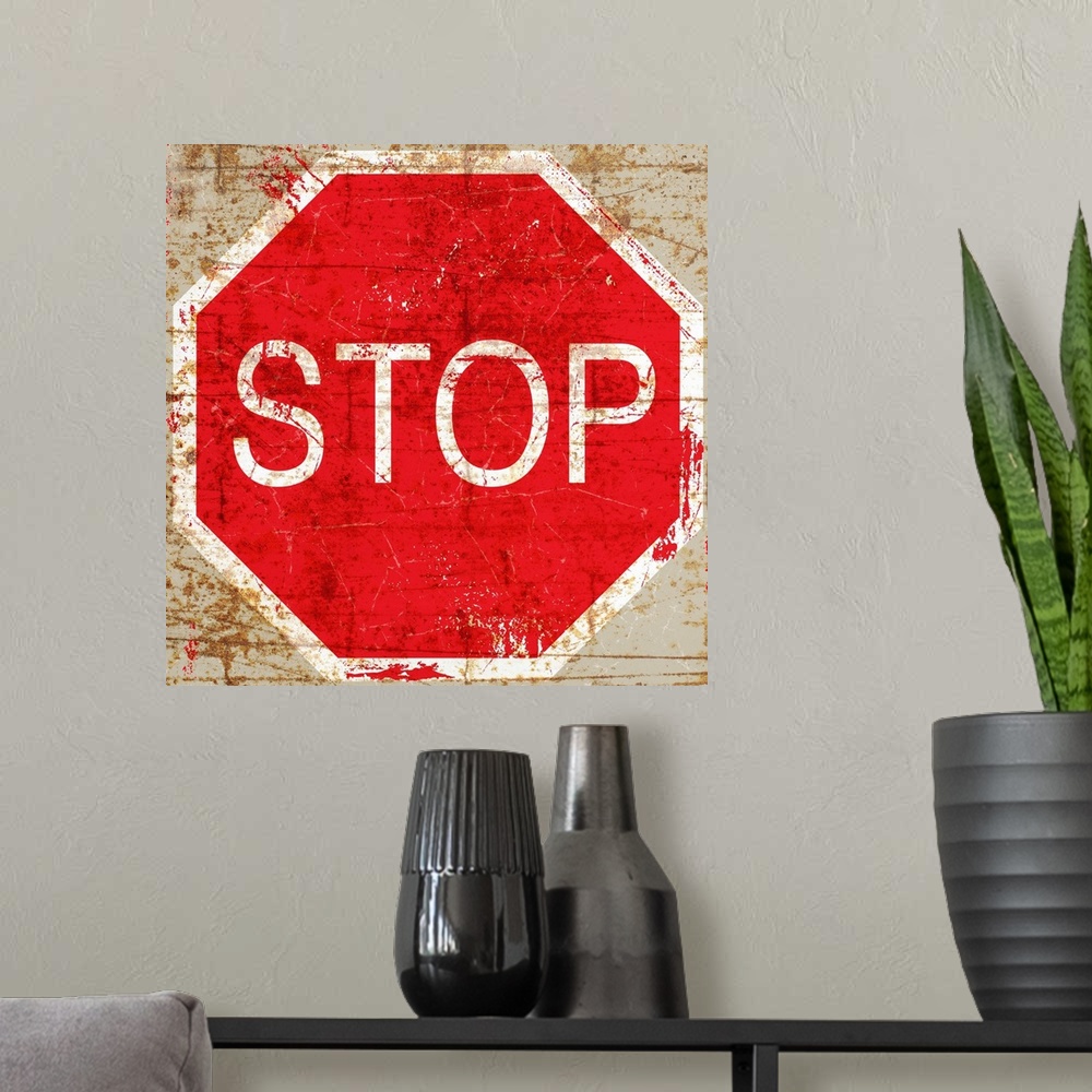 A modern room featuring A worn, distressed, cracked and rusty Stop street sign.