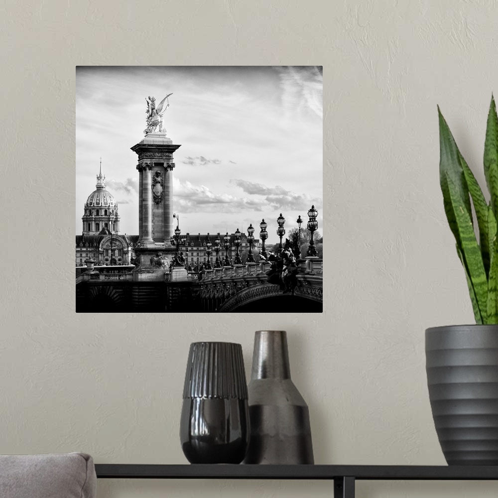 A modern room featuring Black and white photo of a statue on the Pont Alexandre III in Paris, France.