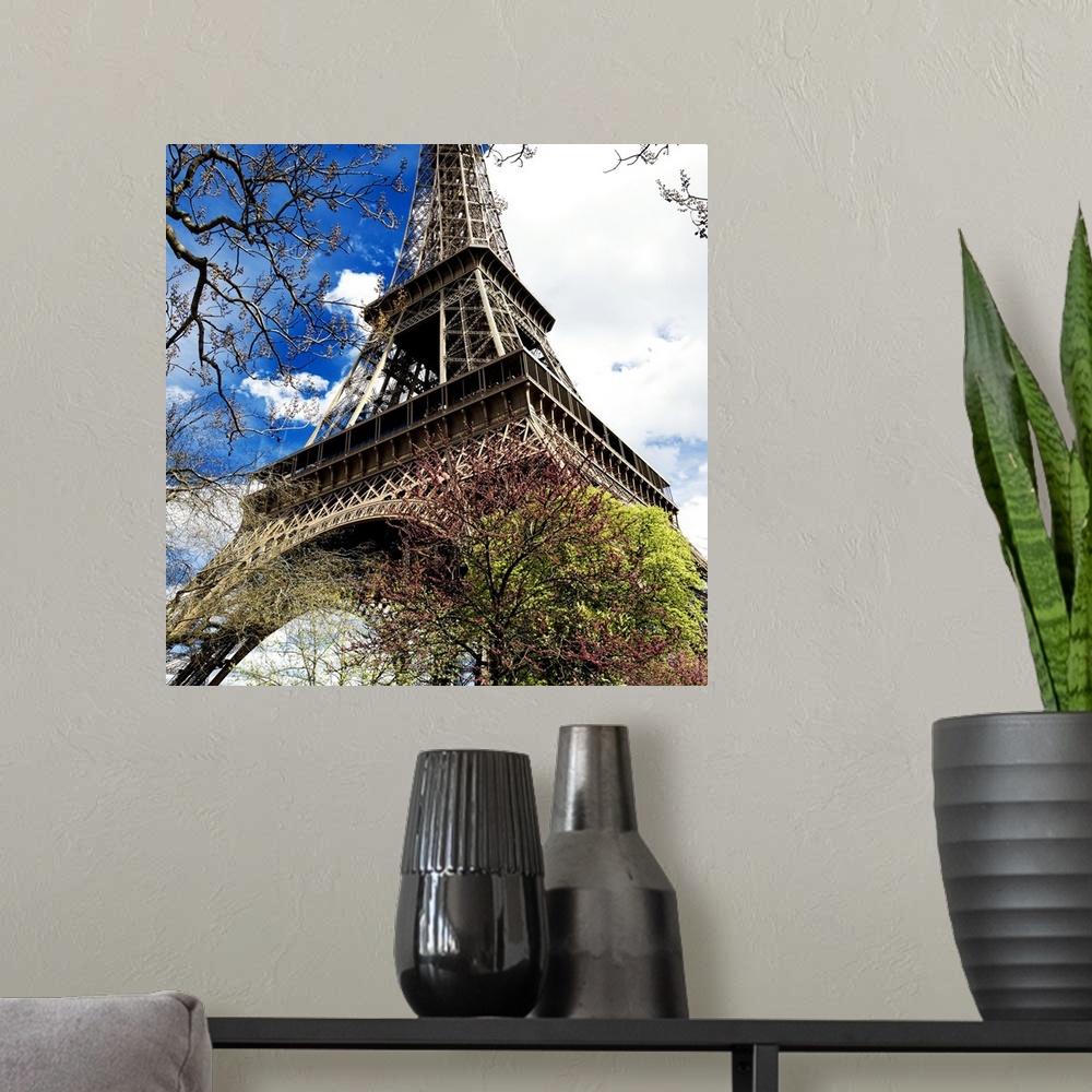 A modern room featuring Fine art photograph of the Eiffel Tower in France, looking up from the ground.