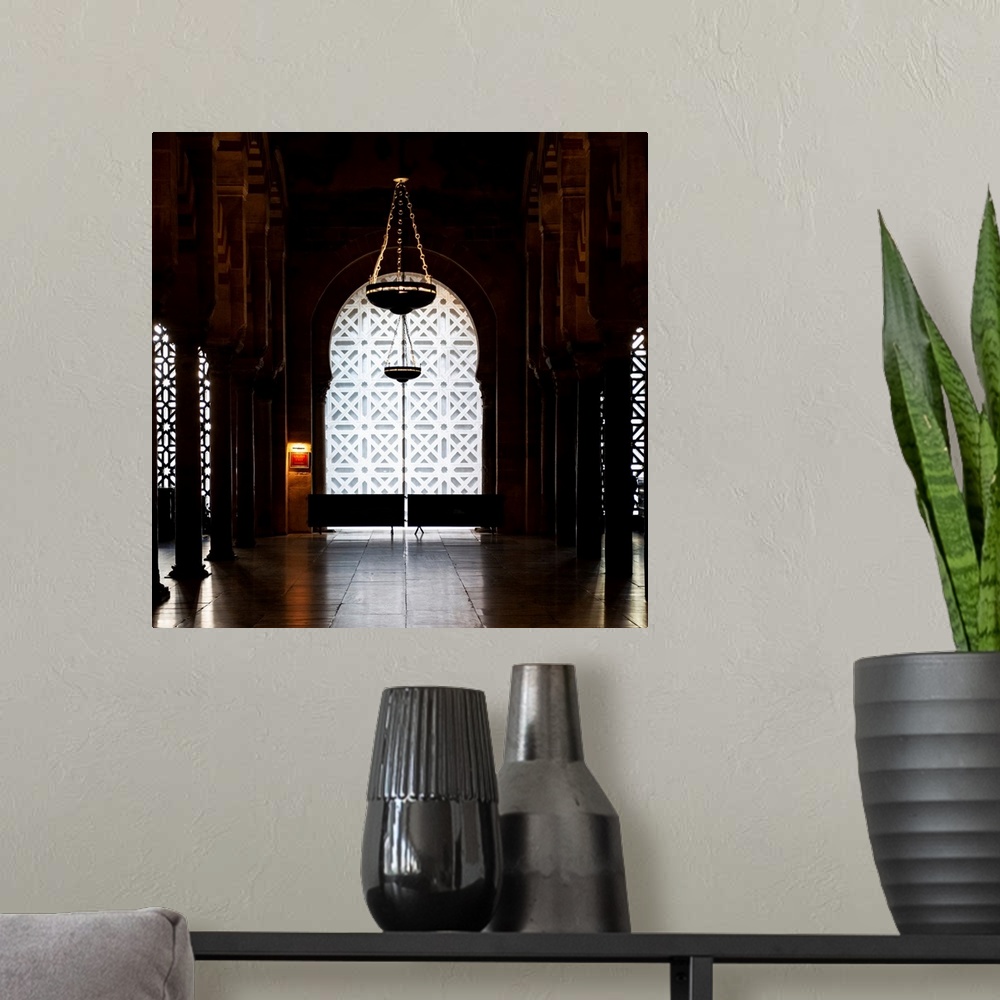 A modern room featuring It's a window overlooking the interior of the Mosque-Cathedral of Cordoba in Spain.