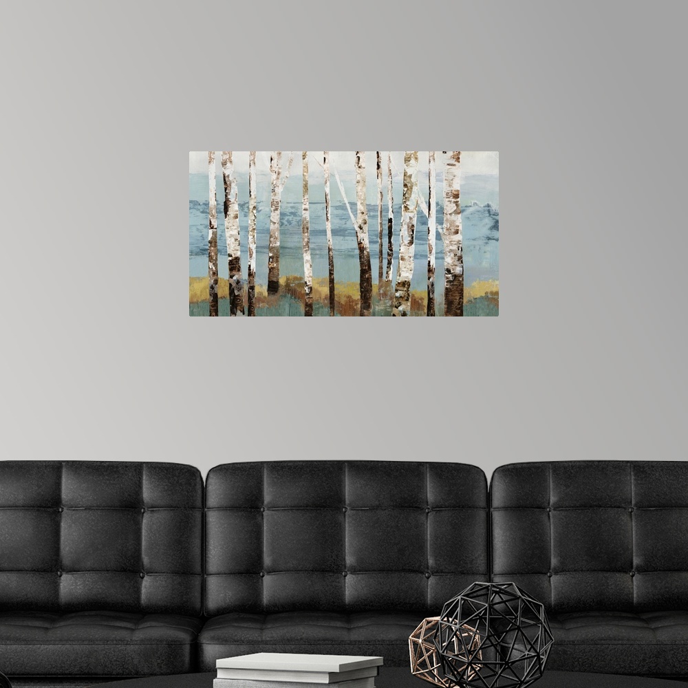 A modern room featuring Contemporary artwork of a row of white birch trees.
