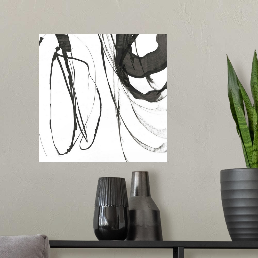 A modern room featuring Quick circular strokes of black paint on white.