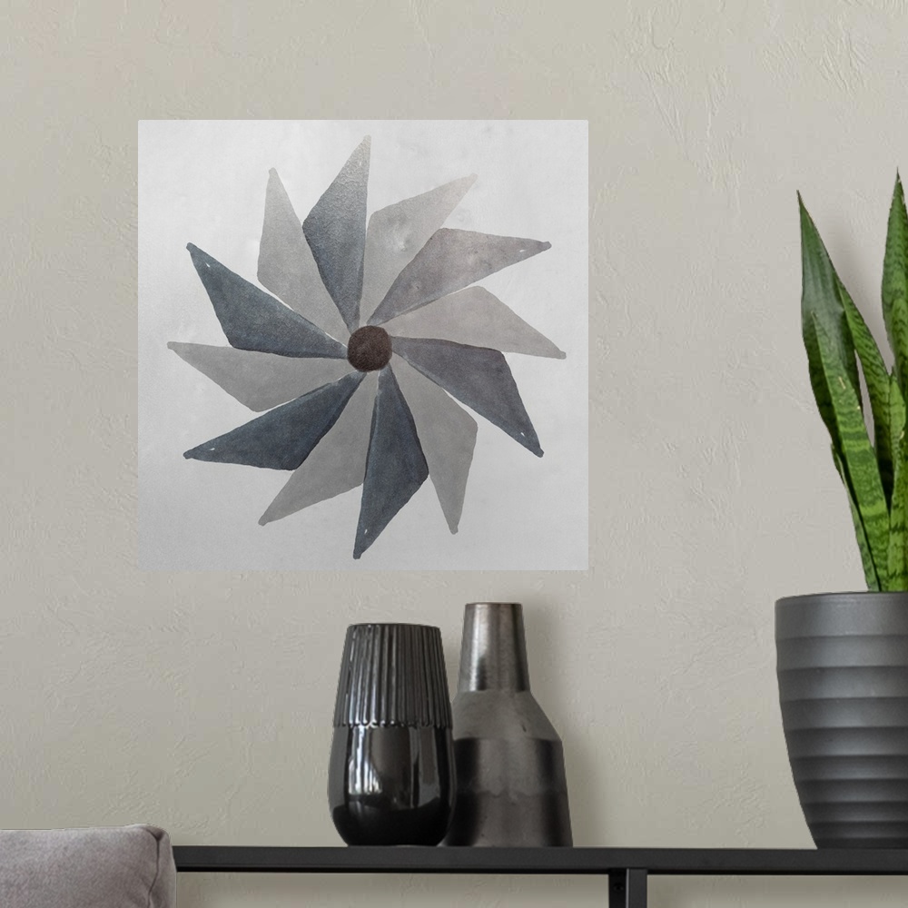 A modern room featuring Abstract pinwheel shape in shades of grey.