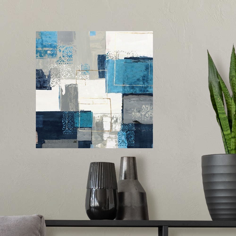 A modern room featuring Bohemian abstract painting in a variety of blue and gray tones with metallic accents.