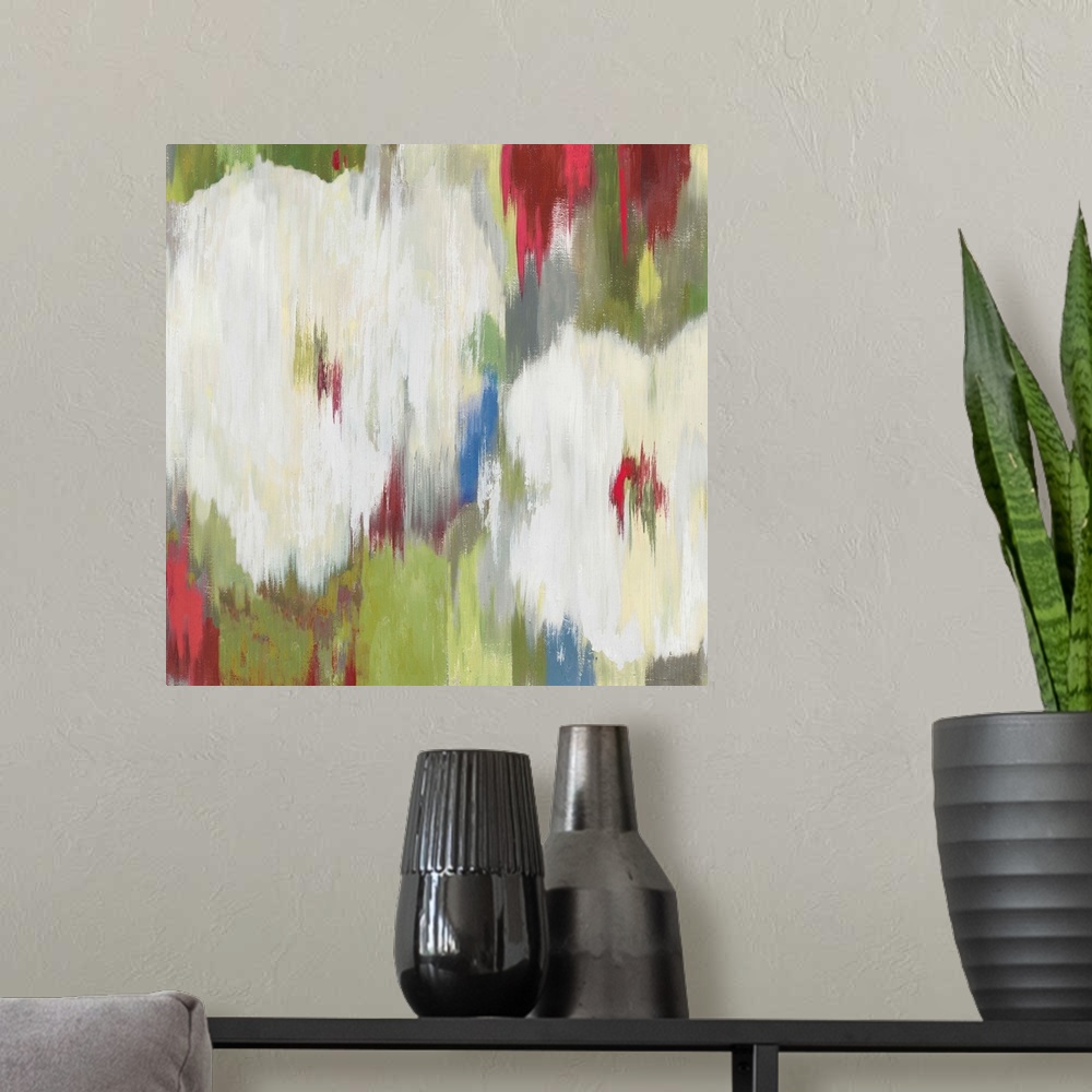 A modern room featuring Contemporary home decor artwork of abstracted flowers in different colors.