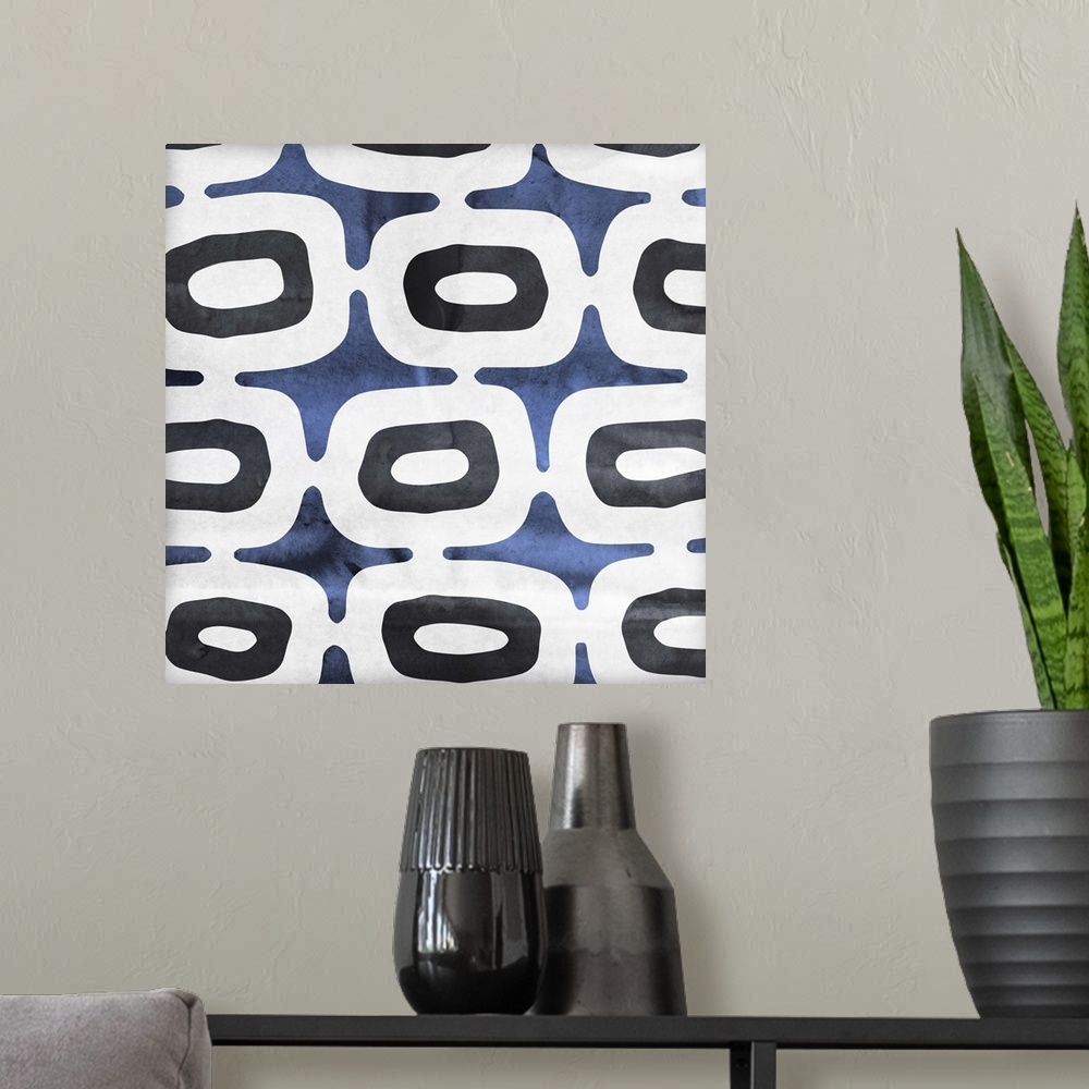 A modern room featuring Contemporary home decor art of a blue and white abstract pattern.