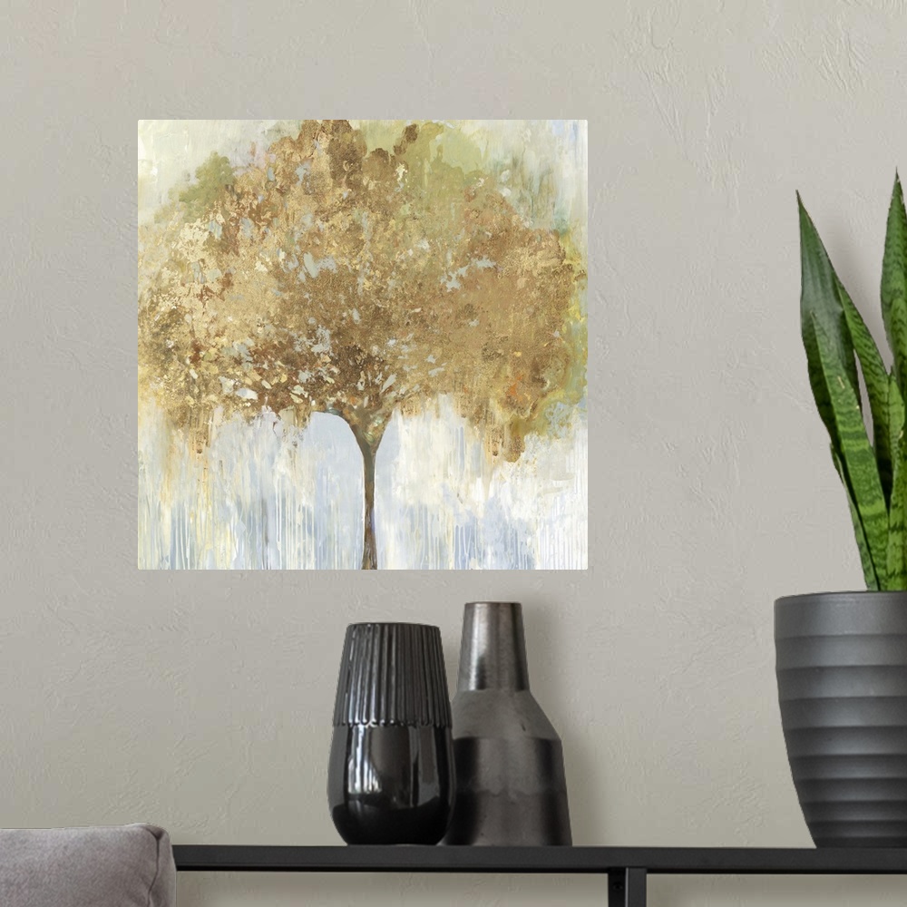 A modern room featuring An abstract painting of a single tree with gold accents in the leaves