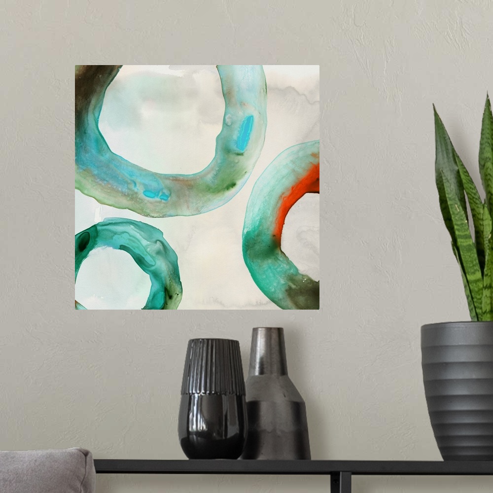A modern room featuring Abstract artwork with watercolor rings in teal.