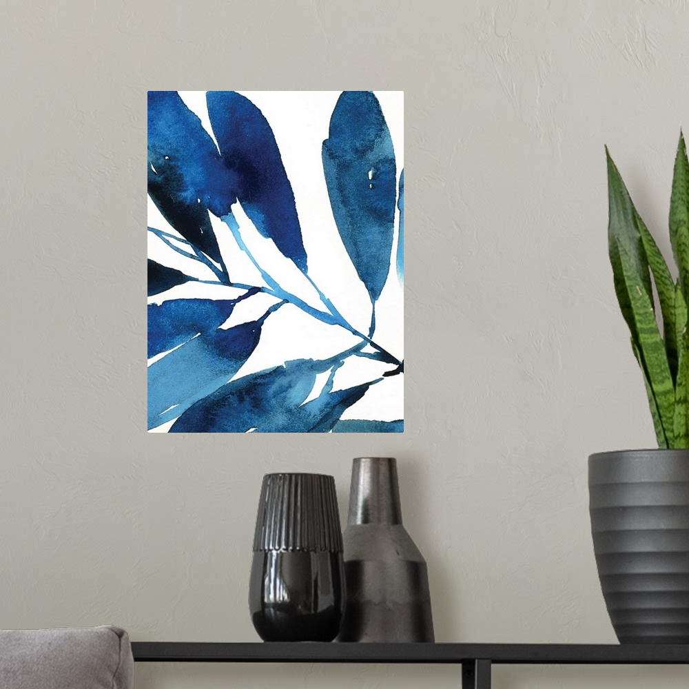 A modern room featuring Watercolor painting in shades of deep blue of several leaves on white.