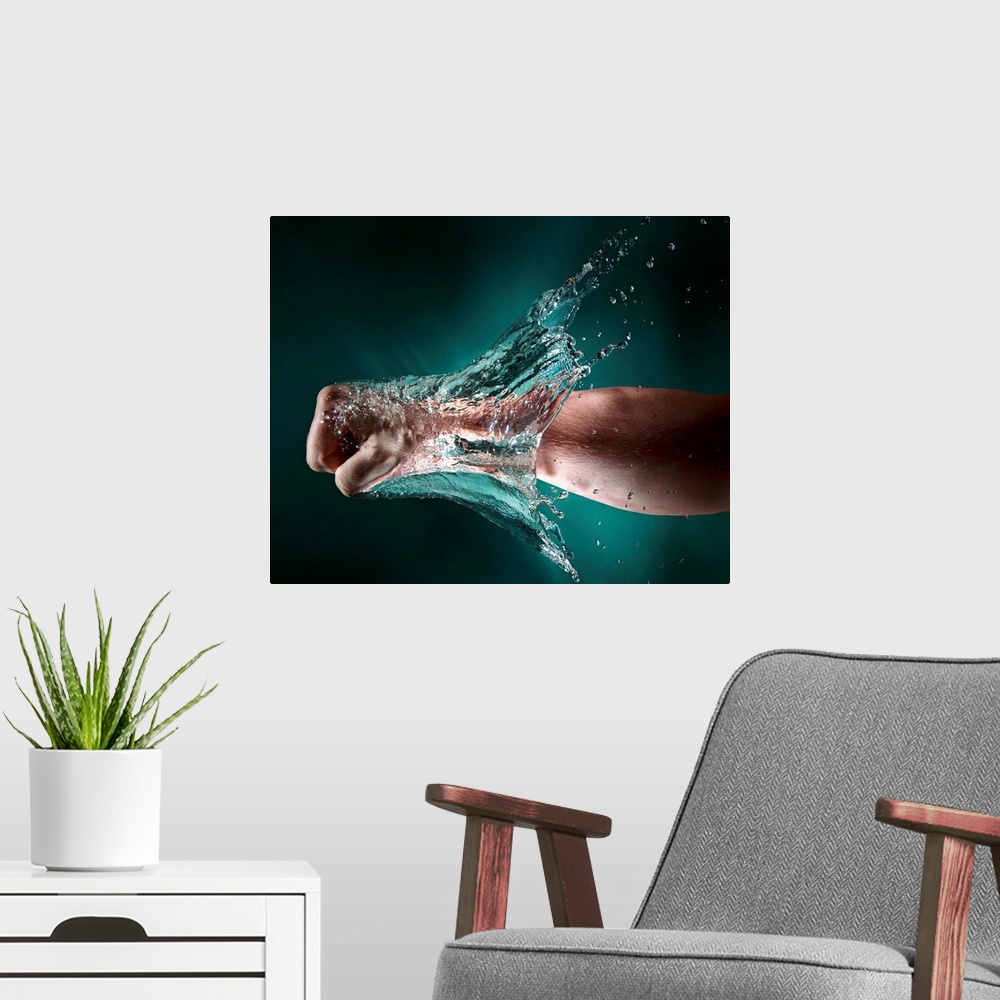 A modern room featuring Photo of a hand punching through a wall of water.