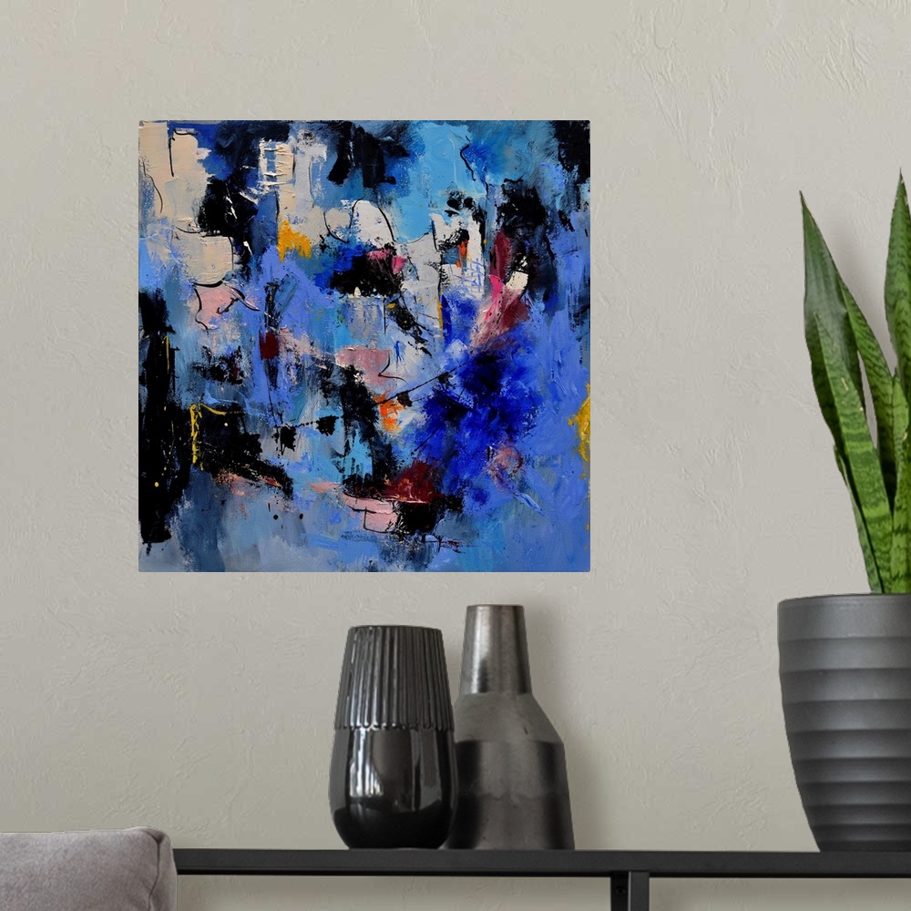 A modern room featuring A square abstract painting in dark shades of black, blue, white and pink with splatters of paint ...