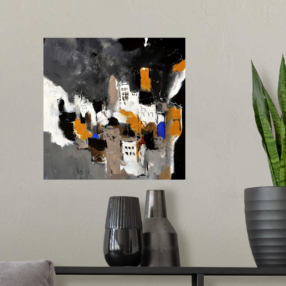 A modern room featuring A square abstract painting in textured shades of black, brown, white and blue with splatters of p...