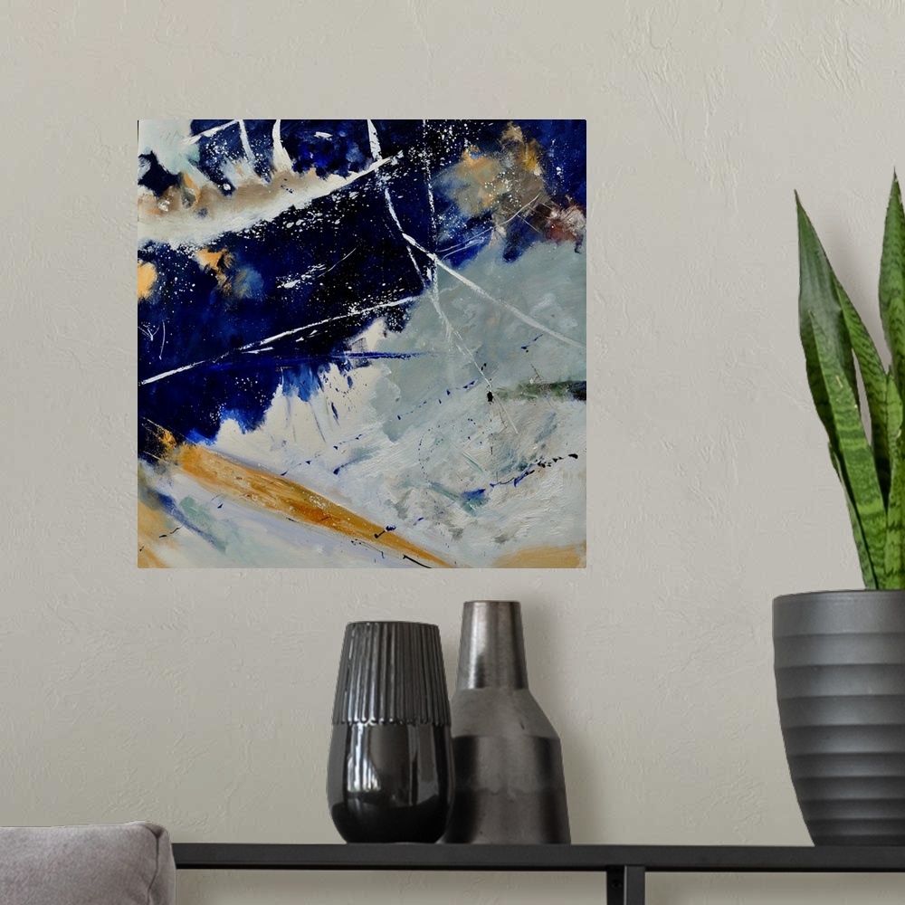 A modern room featuring A square abstract painting of colors of brown, white and blue in bold brush strokes and splattere...