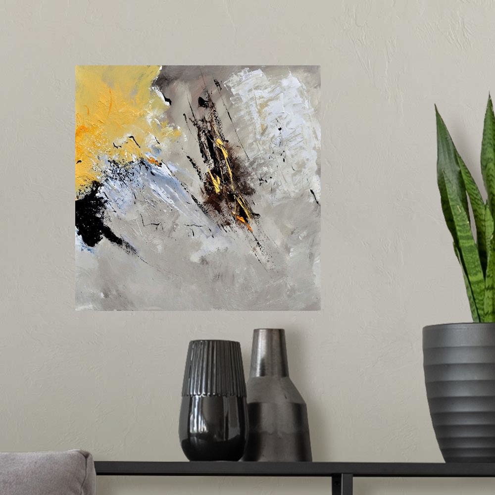 A modern room featuring Abstract painting in shades of black, gray, white and yellow with splatters of paint overlapping.