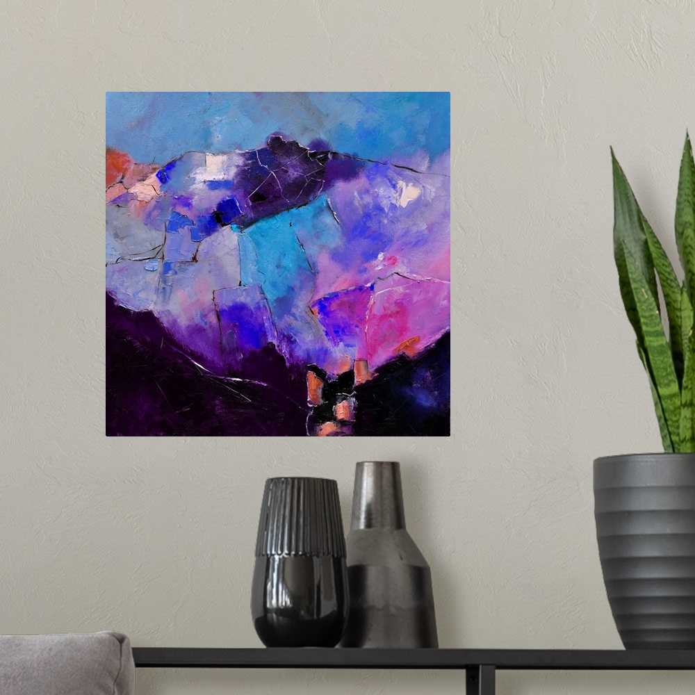 A modern room featuring Abstract painting in shades of purple, blue and pink mixed in with black contrasting designs.