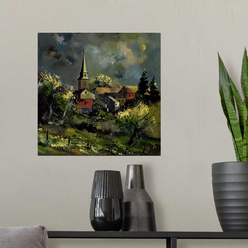 A modern room featuring Square painting of a darkened landscape with a field in the foreground and a Belgium village in t...
