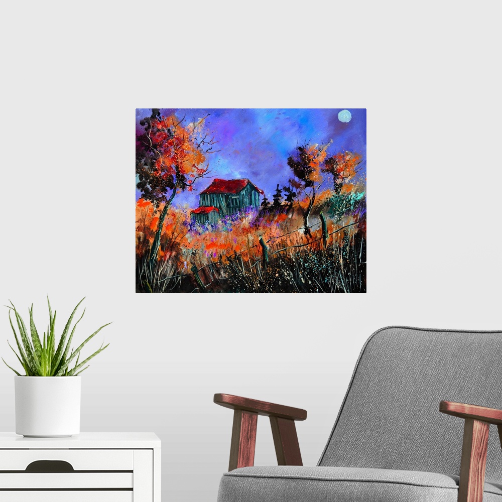 A modern room featuring Vibrant painting of a fall day with golden trees, a colorful sky, and a barn in the distance.