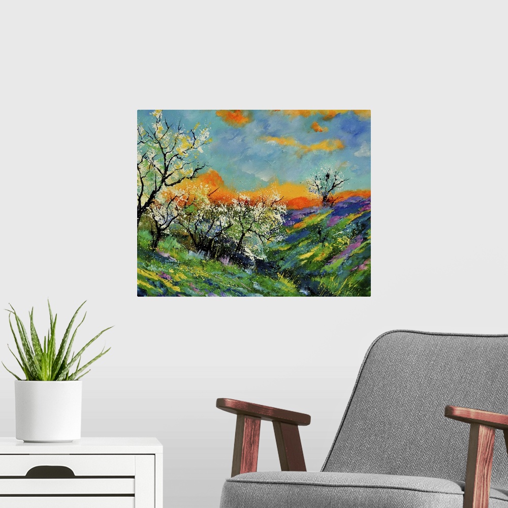 A modern room featuring Vibrant colored springtime scene of a field of blooming flowers and trees with a bright orange/bl...