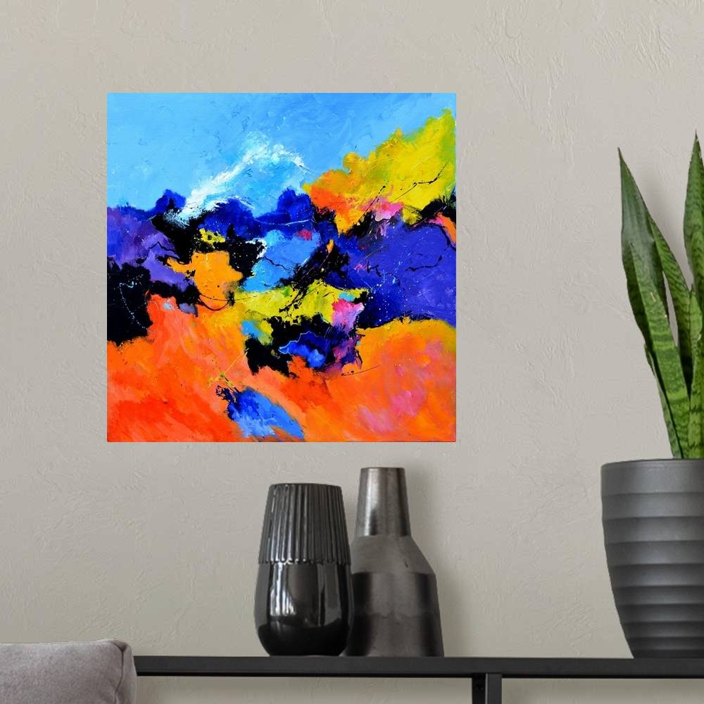 A modern room featuring Abstract painting with vibrant hues in shades of orange, yellow, blue, pink, purple, and white mi...