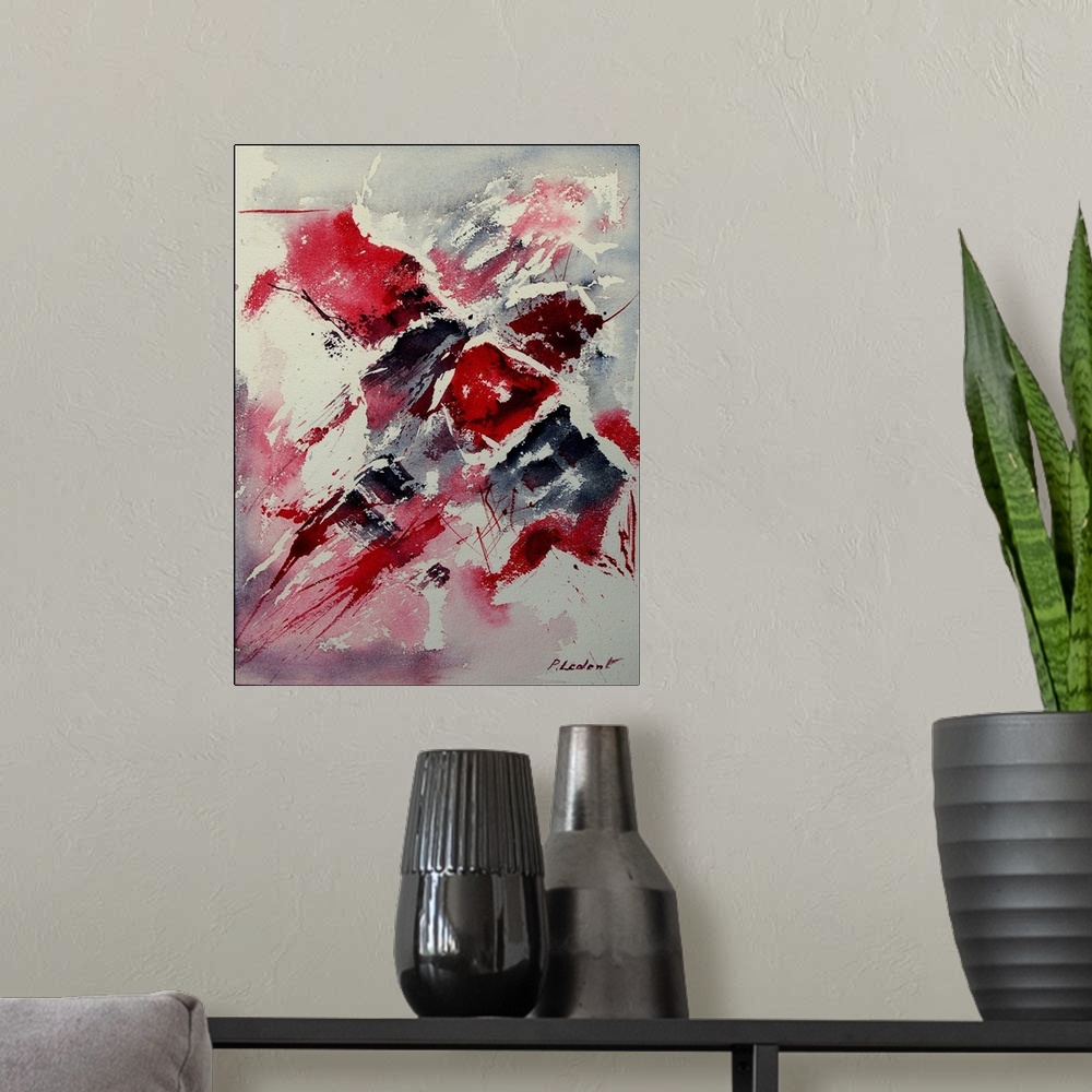 A modern room featuring A vertical abstract painting of colors of red, white and black in bold brush strokes and splatter...
