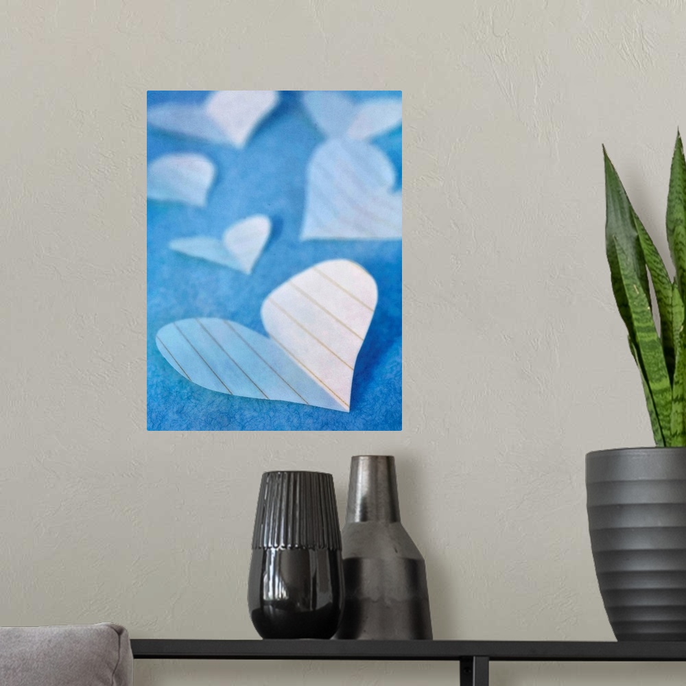A modern room featuring Paper hearts, a sweet still life in blue tones