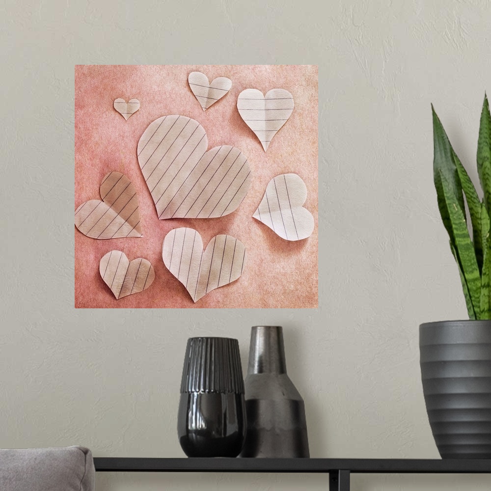 A modern room featuring Hearts, cut out of paper, arranged as a still life