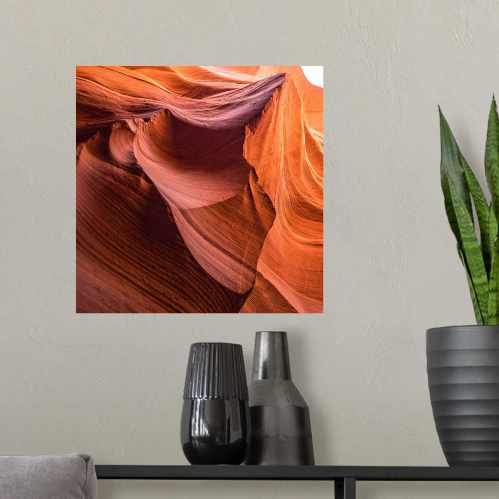 A modern room featuring Square photograph from inside of Antelope Canyon rock formation located on the Navajo Reservation...