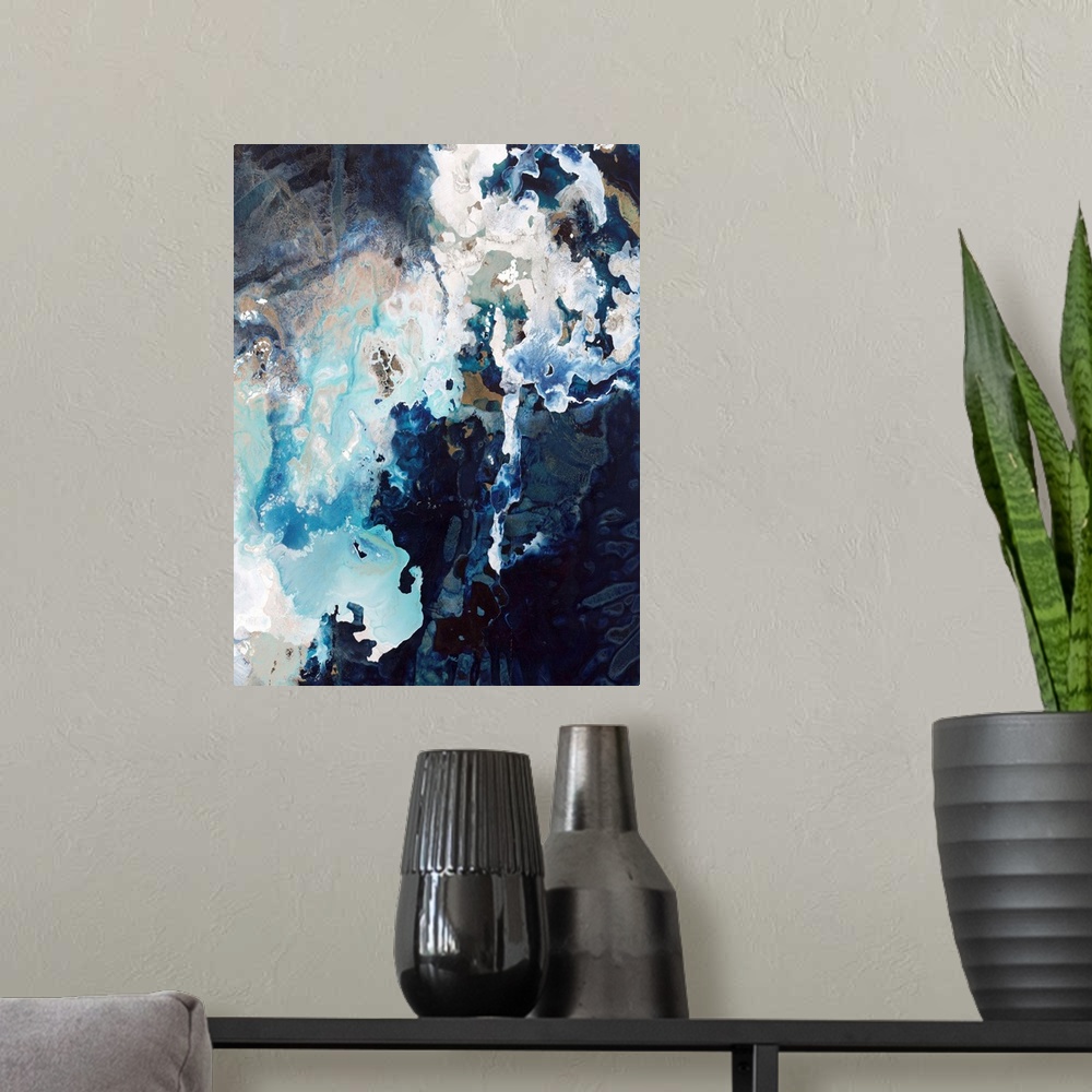 A modern room featuring Abstract contemporary painting with dark navy and bright blue splashes.