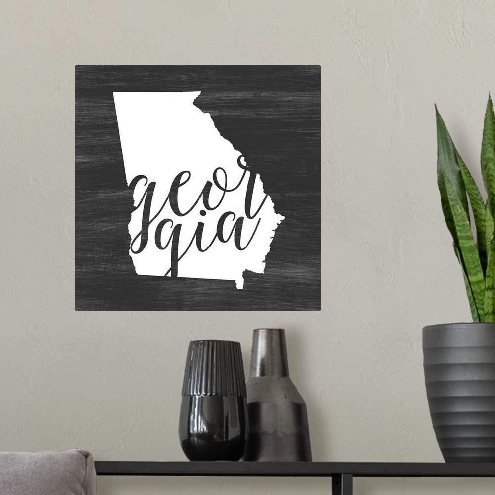 A modern room featuring Georgia state outline typography artwork.