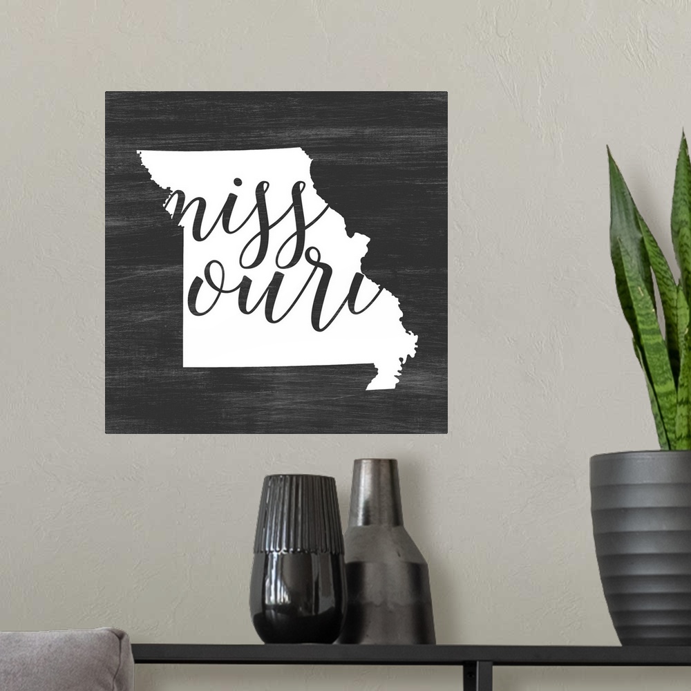 A modern room featuring Missouri state outline typography artwork.
