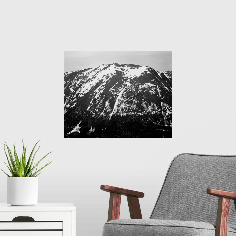 A modern room featuring In Rocky Mountain National Park, full view of barren mountain side with snow.