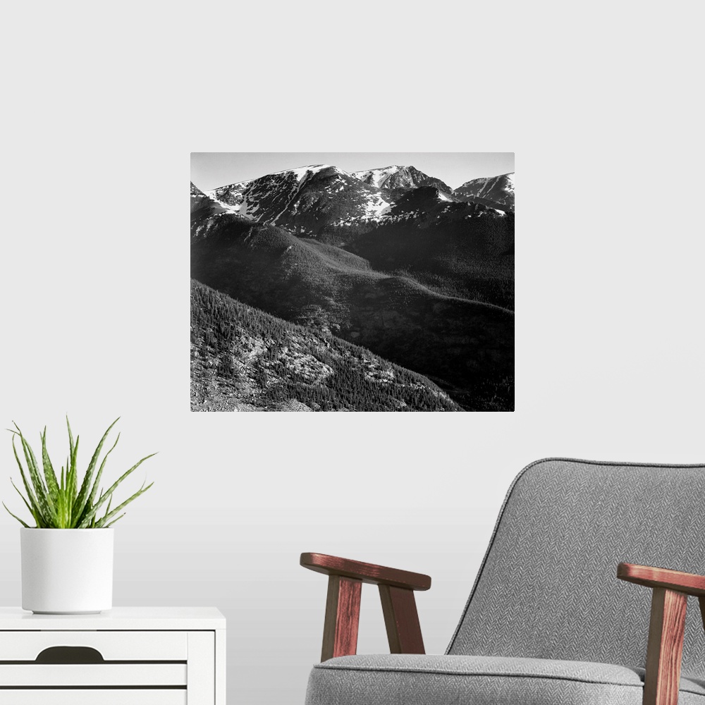 A modern room featuring In Rocky Mountain National Park, panorama of hills and mountains.