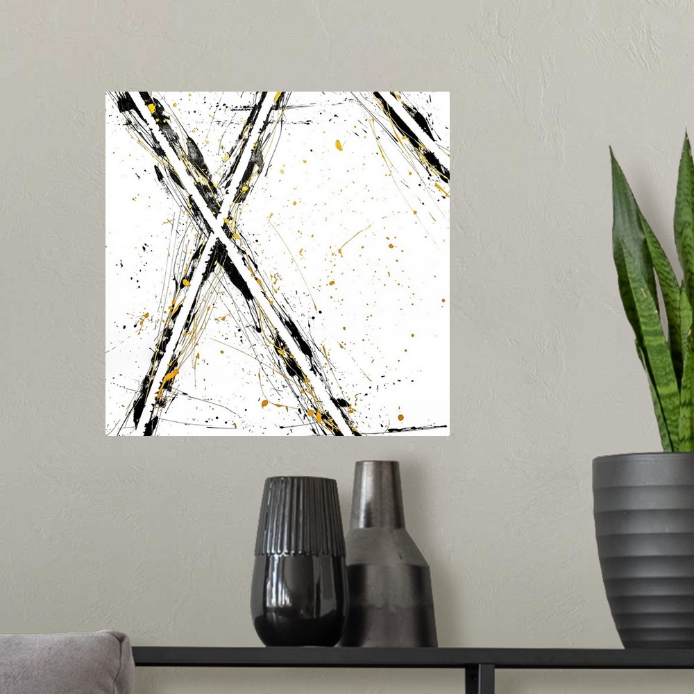 A modern room featuring Abstract contemporary art forming an 'x' shape with black and yellow streaks.