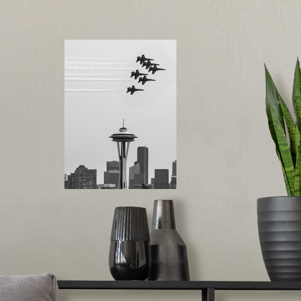 A modern room featuring Black and white photograph of Navy jets flying over the Seattle Space Needle.