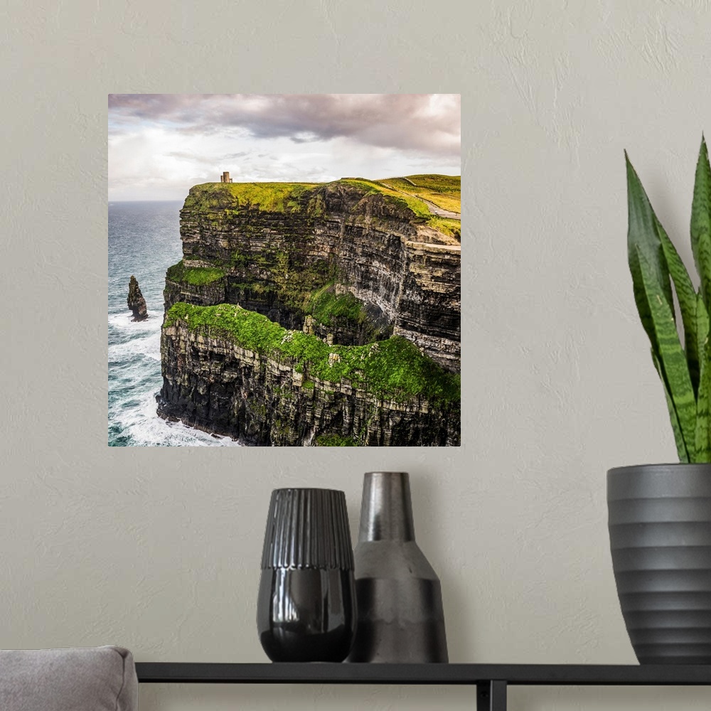 A modern room featuring Square photograph of O'Brien's Tower, marking the highest point of the Cliffs of Moher in Ireland.