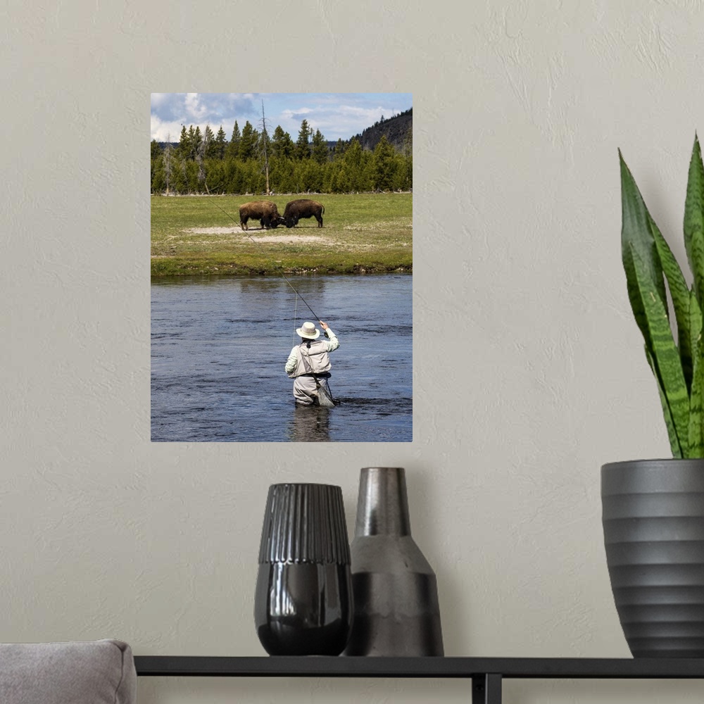 A modern room featuring Person fly fishing in a river at Yellowstone National Park.