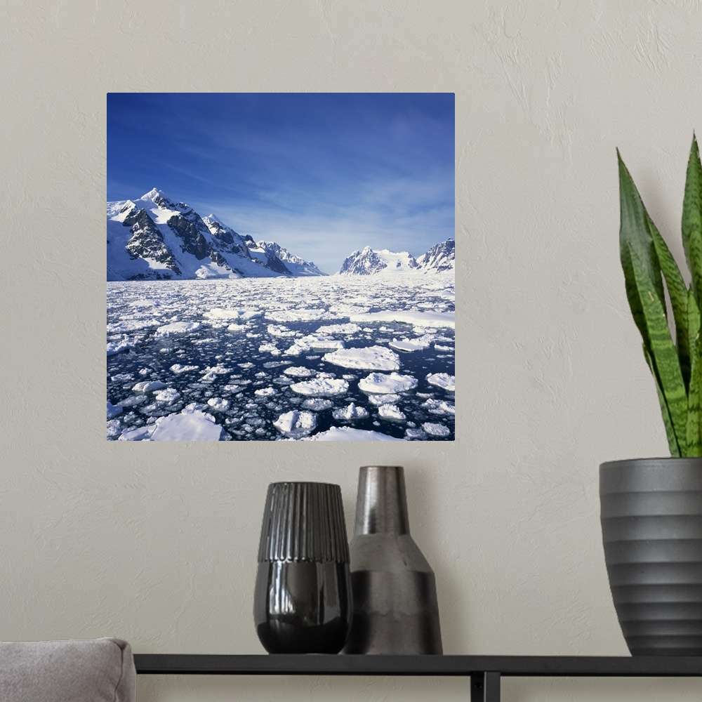 A modern room featuring Loose pack ice in the sea, Antarctic Peninsula in the background, Antarctica