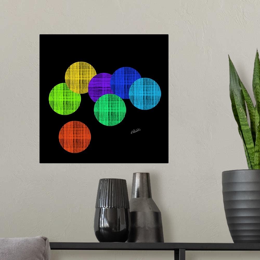 A modern room featuring Vibrant colored circles in a cross hatching pattern overlapping each other on a black backdrop.